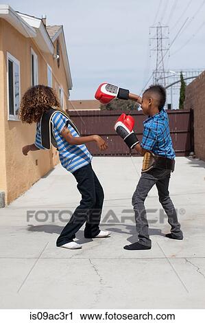 Two brothers boxing View Large Photo Image Stock Image - Two brothers boxing. Fotosearch