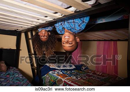 Two brothers leaning over bunkbed View Large Photo Image Stock Image - Two brothers leaning over bunkbed. Fotosearch