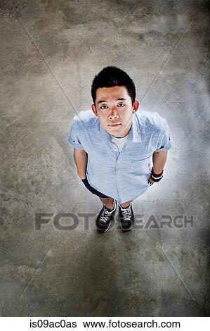Young adults looking up View Large Photo Image Stock Photograph - Young adults looking up. Fotosearch