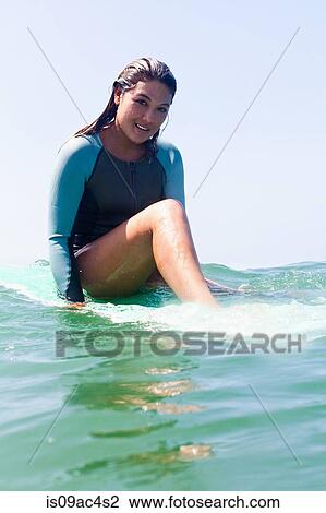 Stock Image - Young woman in sea, Hermosa Beach, California, USA. Fotosearch