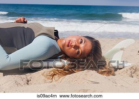 Young woman sunbathing, Hermosa Beach, California, USA View Large Photo Image Picture - Young woman sunbathing, Hermosa Beach, California, USA. Fotosearch