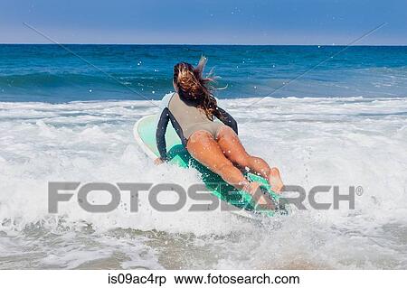 Young woman surfing, Hermosa Beach, California, USA View Large Photo Image Stock Photography - Young woman surfing, Hermosa Beach, California, USA. Fotosearch