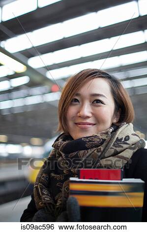 Stock Photograph - Young woman with book. Fotosearch