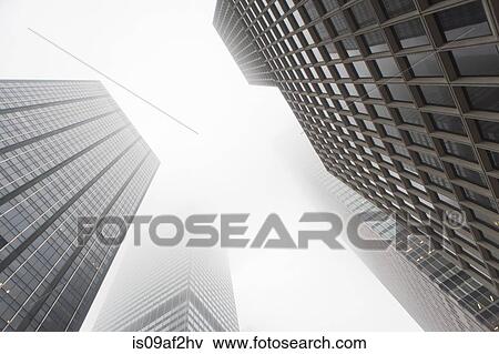 Angled view of skyscrapers in mist, New York City, USA View Large Photo Image Stock Photo - Angled view of skyscrapers in mist, New York City, USA. Fotosearch