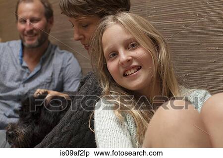 Close up portrait of daughter and parents on sofa View Large Photo Image Stock Photography - Close up portrait of daughter and parents on sofa. Fotosearch