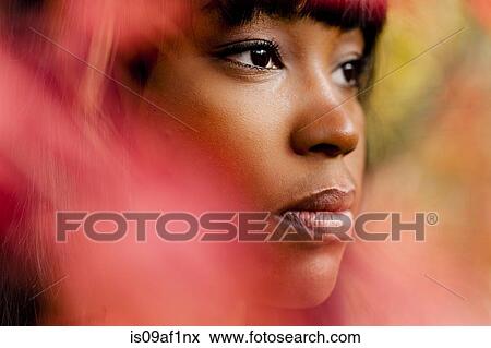 Stock Photo - Close up portrait of thoughtful young woman. Fotosearch