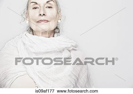 Stock Photo - Cropped studio portrait of senior woman. Fotosearch