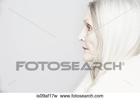 Cropped studio portrait of senior woman in profile View Large Photo Image Stock Photo - Cropped studio portrait of senior woman in profile. Fotosearch