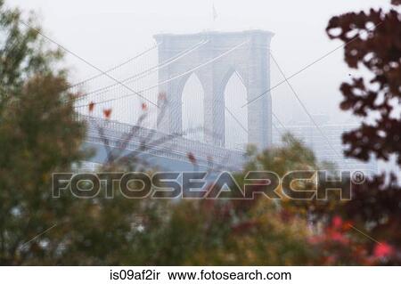 Stock Photography - Detail of Brooklyn Bridge in mist, New York City, USA. Fotosearch