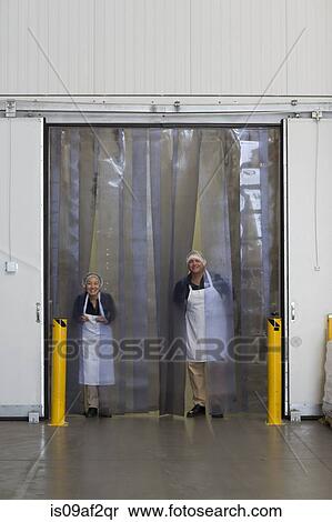 Factory workers by distribution warehouse loading bay View Large Photo Image Stock Photography - Factory workers by distribution warehouse loading bay. Fotosearch