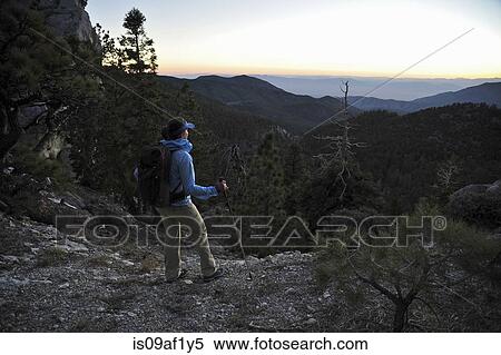 Female hiker looking at morning view, Mount Charleston, Nevada, USA View Large Photo Image Stock Photography - Female hiker looking at morning view, Mount Charleston, Nevada, USA. Fotosearch