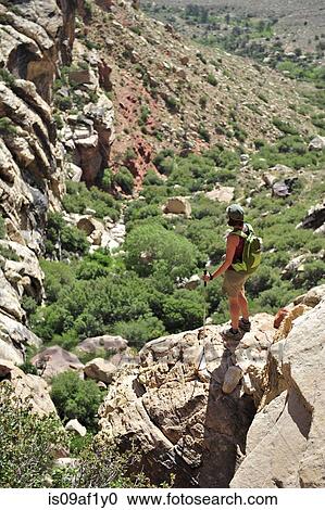 Female hiker standing on rock, Mount Wilson, Red Rock Canyon, Nevada, USA View Large Photo Image Stock Image - Female hiker standing on rock, Mount Wilson, Red Rock Canyon, Nevada, USA. Fotosearch
