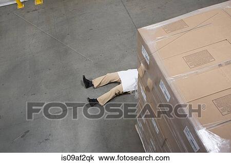 Man lying on floor with cardboard boxes in warehouse View Large Photo Image Stock Image - Man lying on floor with cardboard boxes in warehouse. Fotosearch