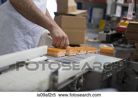 Man packaging vegan cheese in warehouse View Large Photo Image Stock Photography - Man packaging vegan cheese in warehouse. Fotosearch