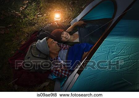 Mature couple lying together in tent View Large Photo Image Stock Photo - Mature couple lying together in tent. Fotosearch
