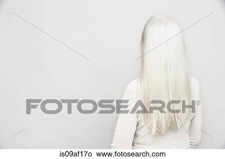Rear view studio portrait of senior woman with long grey hair View Large Photo Image Picture - Rear view studio portrait of senior woman with long grey hair. Fotosearch