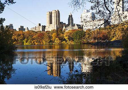 Stock Photograph - Reflections in Central Park lake, New York City, USA. Fotosearch