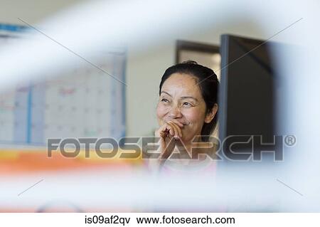 Senior woman using computer View Large Photo Image Stock Photo - Senior woman using computer. Fotosearch