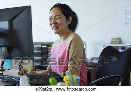 Stock Photograph - Senior woman using computer. Fotosearch