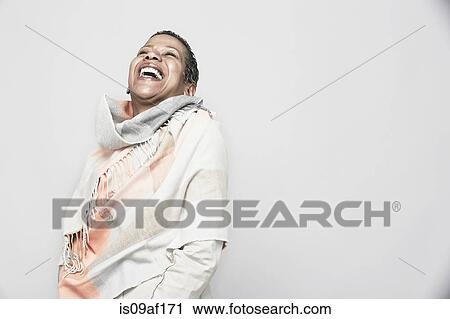 Studio portrait of mature woman laughing View Large Photo Image Stock Image - Studio portrait of mature woman laughing. Fotosearch