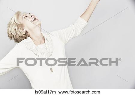 Studio portrait of senior woman laughing View Large Photo Image Picture - Studio portrait of senior woman laughing. Fotosearch