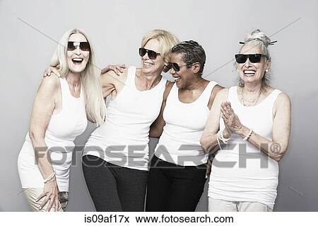 Studio portrait of senior women friends in sunglasses View Large Photo Image Stock Photo - Studio portrait of senior women friends in sunglasses. Fotosearch