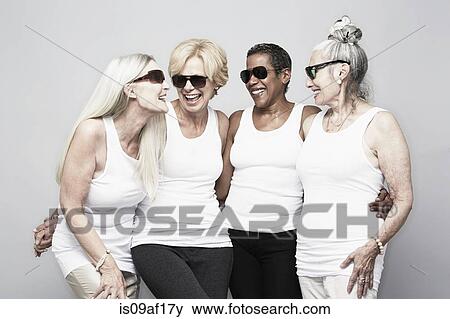 Studio portrait of senior women friends having fun View Large Photo Image Stock Photo - Studio portrait of senior women friends having fun. Fotosearch