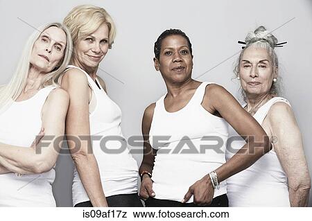 Studio portrait of senior women friends posing for camera View Large Photo Image Stock Photo - Studio portrait of senior women friends posing for camera. Fotosearch