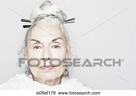 Studio portrait of sophisticated senior woman View Large Photo Image Stock Photo - Studio portrait of sophisticated senior woman. Fotosearch