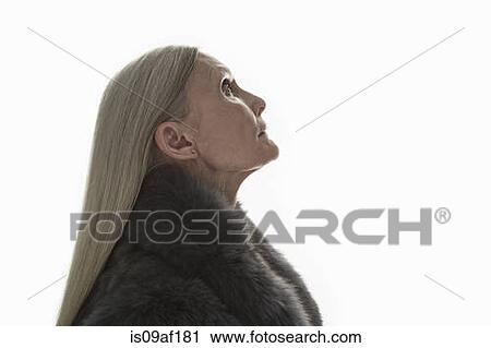 Stock Image - Studio shot of mature woman in profile. Fotosearch