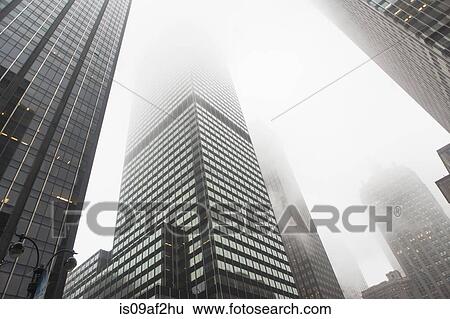 Stock Photograph - View of skyscrapers in mist, New York City, USA. Fotosearch