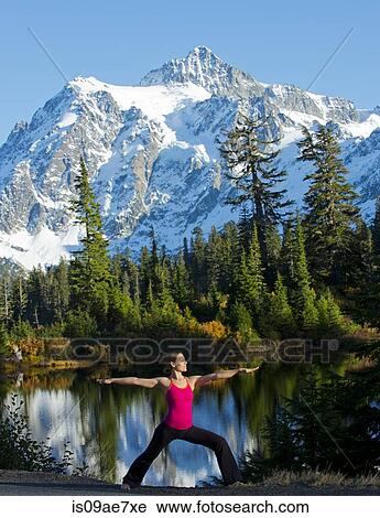 Woman doing yoga in mountain scene, Bellingham, Washington, USA View Large Photo Image Stock Image - Woman doing yoga in mountain scene, Bellingham, Washington, USA. Fotosearch