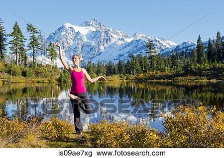 Woman doing yoga in mountain scene, Bellingham, Washington, USA View Large Photo Image Stock Image - Woman doing yoga in mountain scene, Bellingham, Washington, USA. Fotosearch