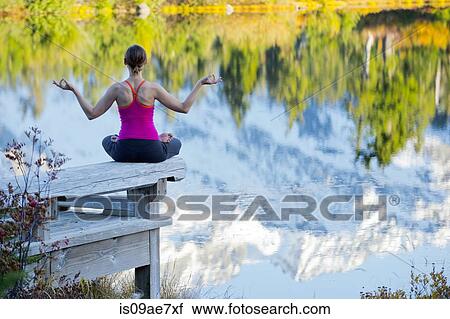 Woman meditating by lake, Bellingham, Washington, USA View Large Photo Image Stock Image - Woman meditating by lake, Bellingham, Washington, USA. Fotosearch