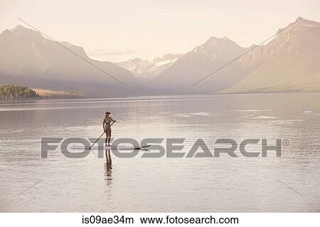 Picture - Woman on canoe, Lake McDonald, Glacier National Park, Montana, USA. Fotosearch
