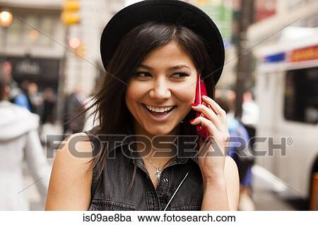 Woman talking on cellular phone View Large Photo Image Stock Image - Woman talking on cellular phone. Fotosearch