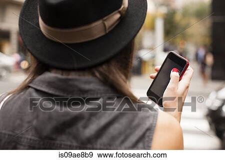 Woman using cellular phone View Large Photo Image Stock Photo - Woman using cellular phone. Fotosearch