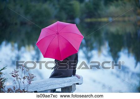 Woman with pink umbrella by lake, Bellingham, Washington, USA View Large Photo Image Stock Image - Woman with pink umbrella by lake, Bellingham, Washington, USA. Fotosearch