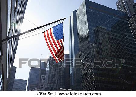 American flag and office buildings, Manhattan, New York, USA View Large Photo Image Stock Image - American flag and office buildings, Manhattan, New York, USA. Fotosearch