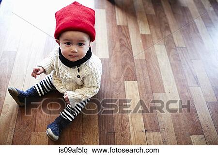 Baby boy sitting on floor View Large Photo Image Stock Photography - Baby boy sitting on floor. Fotosearch