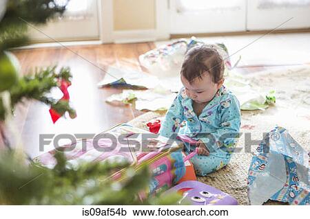 Baby girl opening christmas presents View Large Photo Image Stock Image - Baby girl opening christmas presents. Fotosearch