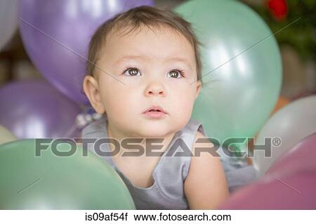 Baby girl with balloons View Large Photo Image Stock Image - Baby girl with balloons. Fotosearch
