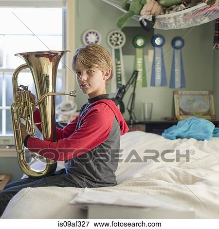Stock Photo - Boy with tuba. Fotosearch