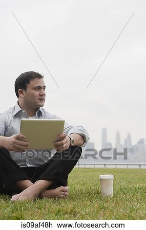 Businessman using laptop, Hoboken, New Jersey, USA View Large Photo Image Stock Image - Businessman using laptop, Hoboken, New Jersey, USA. Fotosearch