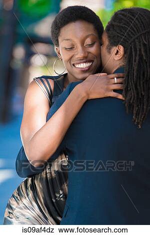 Close up of couple embracing View Large Photo Image Stock Photo - Close up of couple embracing. Fotosearch