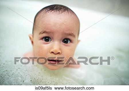 Close up portrait of baby boy in bubble bath View Large Photo Image Stock Photograph - Close up portrait of baby boy in bubble bath. Fotosearch