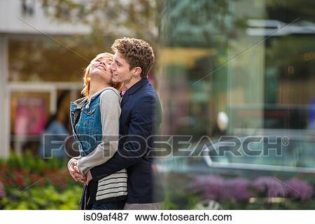 Stock Photo - Couple hugging, Toronto, Ontario, Canada. Fotosearch