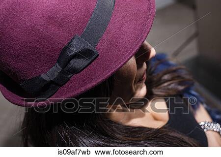 Cropped shot of mid adult woman in purple hat View Large Photo Image Stock Image - Cropped shot of mid adult woman in purple hat. Fotosearch