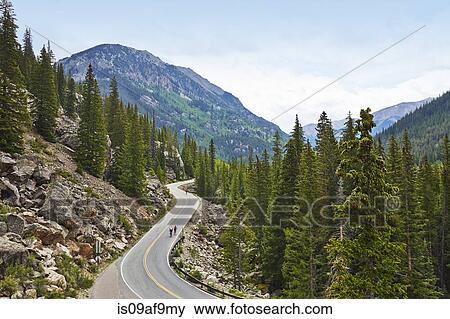 Cyclists on winding highway, Aspen, Colorado, USA View Large Photo Image Stock Photo - Cyclists on winding highway, Aspen, Colorado, USA. Fotosearch