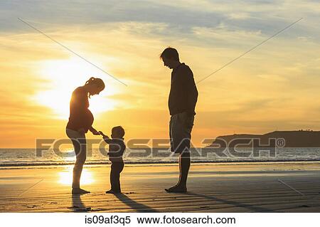 Family and toddler son playing on beach at sunset, San Diego, California, USA View Large Photo Image Stock Photography - Family and toddler son playing on beach at sunset, San Diego, California, USA. Fotosearch